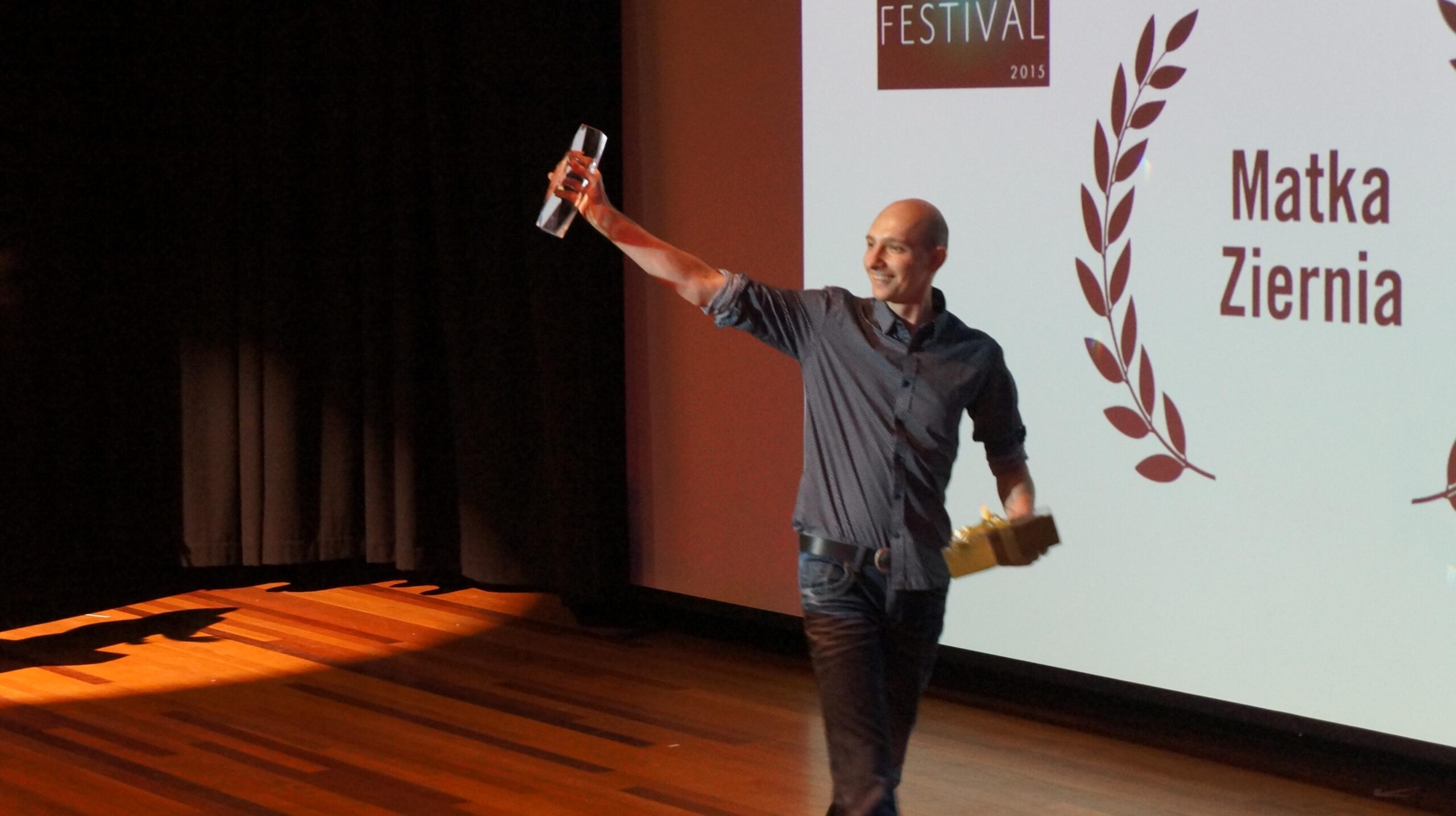 Piotr Zlotorowicz receiving the Best Film award for Mother Earth, 2015